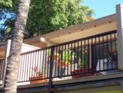 A102 - Upper lanai from private grassed area. Total lanai area is 224 sq. ft.